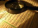 the_holy_quran_and_a_magnifying_glass.jpg