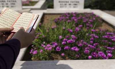 Quran at graveyard, woman attend burial