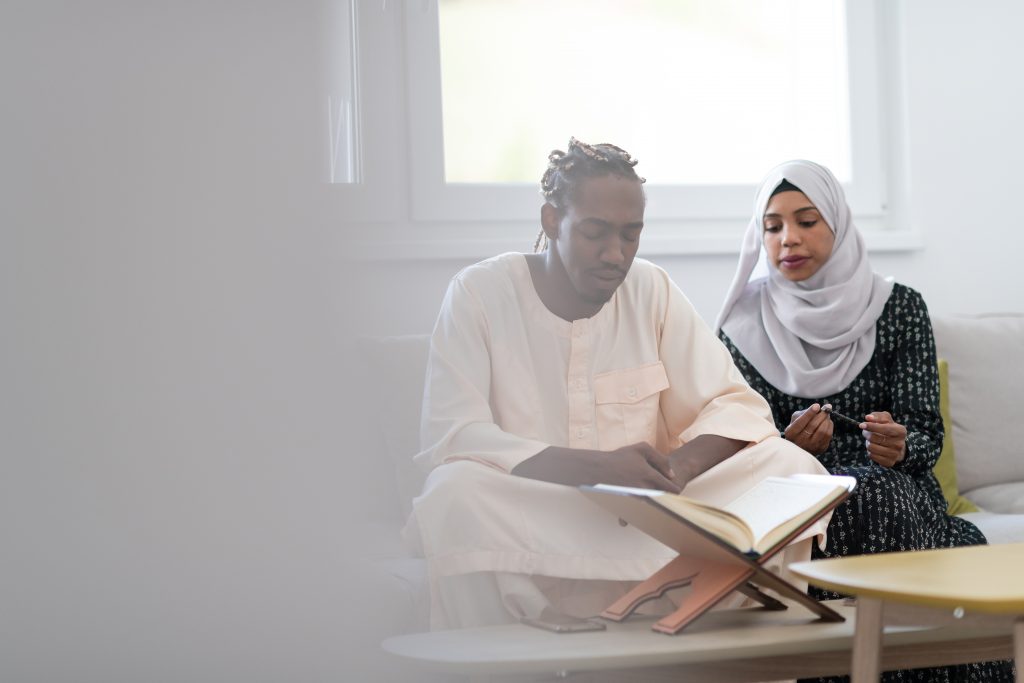 Muslim couple healing reciting Quran