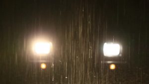 Car headlights in the rain