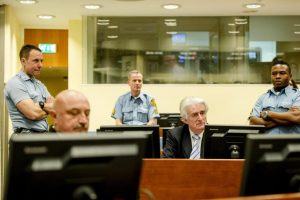 Bosnian Serb wartime leader Radovan Karadzic, 2nd right, in the courtroom for the reading of his verdict at the International Criminal Tribunal for Former Yugoslavia (ICTY) in The Hague, The Netherlands Thursday March 24, 2016. The former Bosnian-Serbs leader is indicted for genocide, crimes against humanity, and war crimes. (Robin van Lonkhuijsen, Pool via AP)