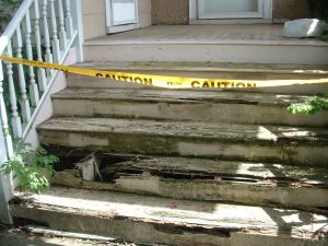 Rotting wooden porch steps